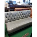 Grey leather bench seat.