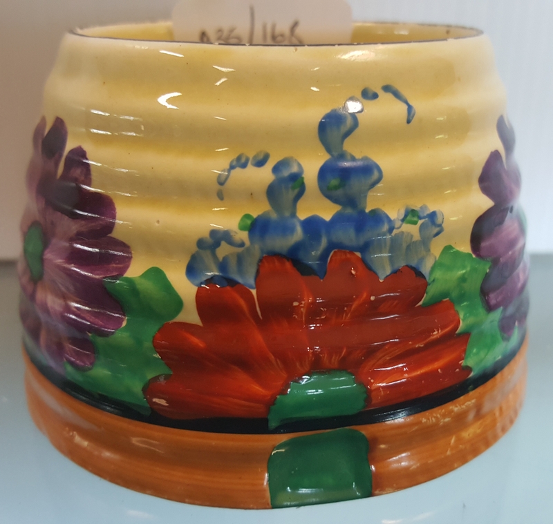 Clarice Cliff honey pot in the 'Gay Day' pattern for Newport Potteries.