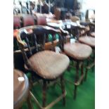 Set of four high swivel pub stools.