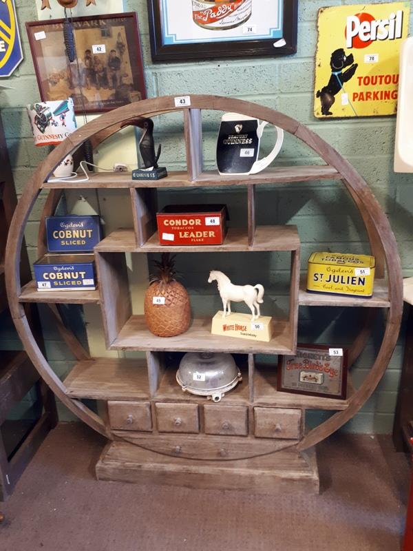 Unusual hardwood circular open bookcase.