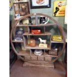 Unusual hardwood circular open bookcase.