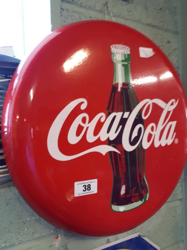 Circular COCA COLA enamel advertising sign.