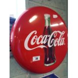 Circular COCA COLA enamel advertising sign.