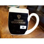 Plastic GUINNESS counter display sign in the form of a pint glass.