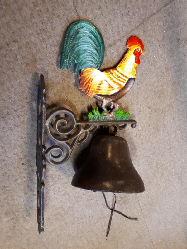 Cast iron bell in the form of a Rooster.