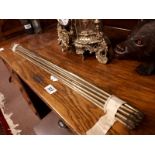 Collection of brass stair rods.