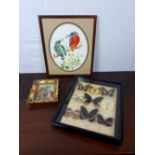 Collection of three framed art works.