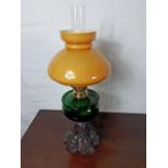 19th. C. oil lamp with cast iron base, green glass bowl and mushroom shade.