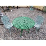 Decorative 20th C.cast garden table and two chairs.