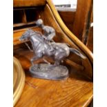 Bronze model of a horse and jockey.