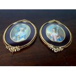 Pair of gilded metal framed portraits of ladies.