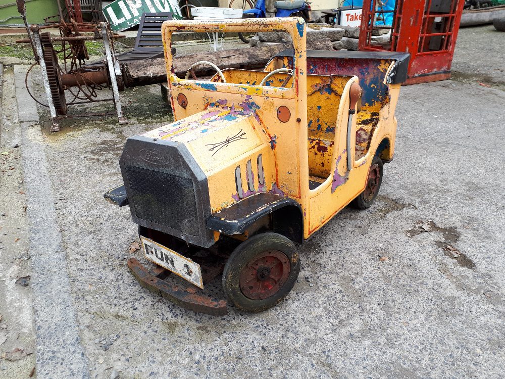 Carnival ride yellow truck.