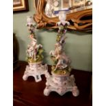 Pair of 19th. C. German ceramic candlesticks decorated with horses and boys.