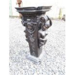 Decorative square bronze torchere decorated with maidens, scrolls and shells. { 79cm H }.