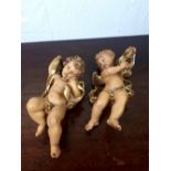 Carved wooden hand painted wall hanging cherubs.