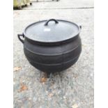 Cast iron metal pot with lid.