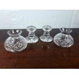 Four cut crystal candle holders.