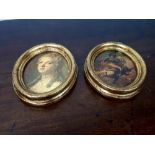 Two oval gilt framed pictures.