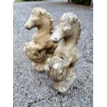 Pair of composition stone horses.