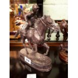 Bronze model of a horse and jockey.