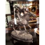 Bronze model of a horse and jockey.