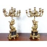 Pair of 19th. C. brass six branch candelebra with cherubs mounted on marble bases. { 60cm H }.