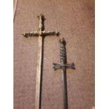 Two ceremonial swords - one decorated with a skull.