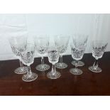 Two sets of four Waterford crystal wine glasses.