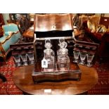 19th. C. rosewood decanter box inlaid with brass, with original glass decanters and glasses.