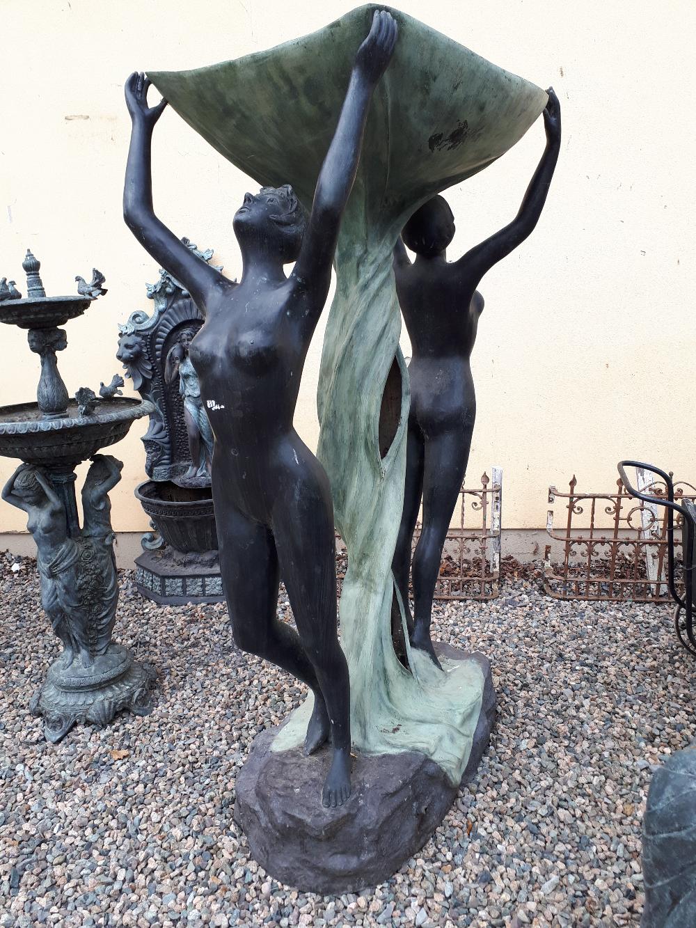 Good quality bronze fountain in the form of a tree trunk flanked by two nudes holding aloft a bowl.