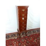 Mahogany chest with six long drawers .