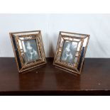 Pair of mirror decorated picture frames.