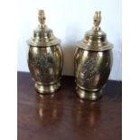 Pair of embossed brass Urn shaped table lamps.