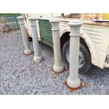 Two pairs of cast iron bollards.