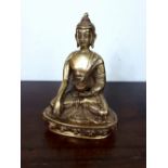Chinese brass figure of a seated Buddha.