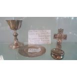 Collectiong of silver itmes wine goblet, paten, reliquary and a waffer box.