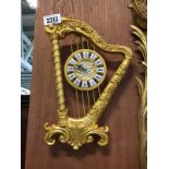 Wall mounted gilded clock in the form of a harp