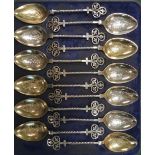 Cased Set of Twelve 19thC. French Silver-Plate & Gilt Spoons with twist handles and trefoil finials.