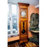 French long cased clock with gilded face. { 91'' H }.