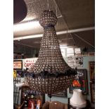 Decorative hanging glass and metal chandelier.