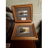 Pair of framed oil on board lake scenses.