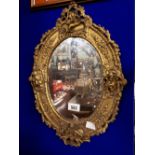 Decorative19th. C. oval gilt mirror in the Georgian style.