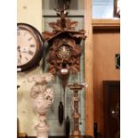 Early 20th. C. carved walnut cuckoo clock in the Black Forest style.