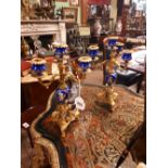 Pair of decorative three branch gilded metal and poreclain candelabras {33cm H}/