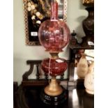 Victorian ruby table lamp with ruby bowl and shade.