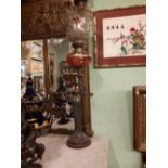 Art Nouveau gilded metal table lamp base in the form of a Lady with ruby bowl and etched shade.