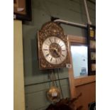 Decorative brass wall clock.