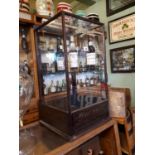 Early 20th C. mahogany Ingersoll watches and clocks advertising cabinet.