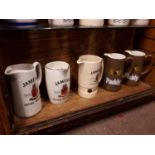 Set of 5 Irish whiskey water jugs.