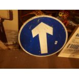 tin plate circular arrow road sign.